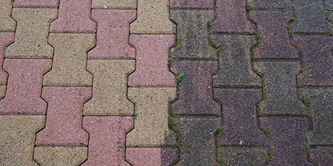 a clean driveway on the left and dirty on the right as a comparision